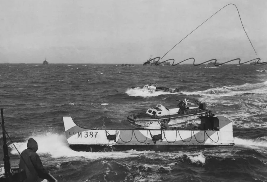 A Landing Craft, Mechanised at sea, with two other craft behind